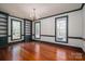 Elegant living room with built-in shelving, wainscoting, and large windows at 246 Jerry Crump Rd, Lincolnton, NC 28092