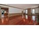 Hardwood floors connect to the living room with fireplace and built-in shelving at 246 Jerry Crump Rd, Lincolnton, NC 28092