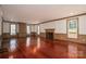 A spacious living room showcases hardwood floors, fireplace and many windows at 246 Jerry Crump Rd, Lincolnton, NC 28092