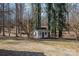 Quaint outbuilding is nestled among mature trees at 246 Jerry Crump Rd, Lincolnton, NC 28092