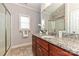 Bathroom featuring granite countertops, wood cabinets, a glass-enclosed shower, and contemporary fixtures at 258 Lagoda Dr, Locust, NC 28097