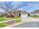 Charming brick home featuring a manicured lawn and a bright, spacious garage at 258 Lagoda Dr, Locust, NC 28097