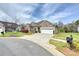 Charming brick home with a manicured front yard and two-car garage at 258 Lagoda Dr, Locust, NC 28097