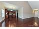 Open-concept kitchen featuring dark wood cabinetry, an island with granite countertops, and stainless steel appliances at 258 Lagoda Dr, Locust, NC 28097