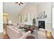 Staged living room featuring a fireplace, custom shelving, and hardwood floors at 258 Lagoda Dr, Locust, NC 28097