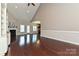 Open living space with wood floors, a fireplace, and access to the kitchen at 258 Lagoda Dr, Locust, NC 28097