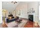 Staged living room with hardwood floors, fireplace, built-in shelves and lots of natural light at 258 Lagoda Dr, Locust, NC 28097
