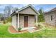 Charming outbuilding with brick siding and lush landscaping at 258 Lagoda Dr, Locust, NC 28097
