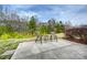 A peaceful patio setting offers tranquil views of lush green trees at 258 Lagoda Dr, Locust, NC 28097