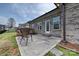 Enjoy outdoor relaxation on this backyard patio featuring comfortable seating at 258 Lagoda Dr, Locust, NC 28097