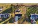 A high-angle shot of the house with a fenced pool, mature trees, and long driveway at 2745 River Meadows Ct, Lincolnton, NC 28092