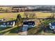 Aerial shot of a quaint two-story home with mature trees and a long driveway at 2745 River Meadows Ct, Lincolnton, NC 28092