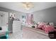 Cozy bedroom featuring a large bed, vanity, and a window with natural light at 2745 River Meadows Ct, Lincolnton, NC 28092