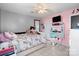 Charming bedroom with a desk, plush bed, and ample natural light at 2745 River Meadows Ct, Lincolnton, NC 28092