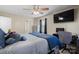 Bedroom with a large bed, TV, desk, and natural light from the windows at 2745 River Meadows Ct, Lincolnton, NC 28092