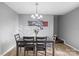Elegant dining room featuring modern chandelier lighting and comfortable upholstered seating at 2745 River Meadows Ct, Lincolnton, NC 28092