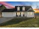 Charming two-story home featuring a well-maintained lawn and a two-car attached garage at 2745 River Meadows Ct, Lincolnton, NC 28092