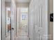 Hallway featuring doors, neutral paint and tile floors at 2745 River Meadows Ct, Lincolnton, NC 28092