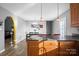 Open kitchen with modern countertop and stainless steel appliances flowing into dining area at 2745 River Meadows Ct, Lincolnton, NC 28092