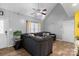 Cozy living room with vaulted ceilings, modern ceiling fan, and comfortable sectional sofa at 2745 River Meadows Ct, Lincolnton, NC 28092