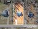 An aerial view showcases the home's roof, backyard, long driveway, and its position in a rural neighborhood at 2853 W Zion Church Rd, Shelby, NC 28150