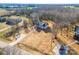 An aerial view captures a cozy single-Gathering home on a large lot with a long driveway and plenty of space at 2853 W Zion Church Rd, Shelby, NC 28150