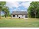 Spacious backyard with a well-maintained lawn and rear view of home at 2853 W Zion Church Rd, Shelby, NC 28150