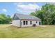 Spacious backyard with a well-maintained lawn and rear view of home at 2853 W Zion Church Rd, Shelby, NC 28150