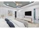 Bright bedroom features a ceiling fan, neutral walls, and a view into the sleek tiled en-suite bathroom at 2853 W Zion Church Rd, Shelby, NC 28150