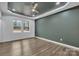 Spacious bedroom with tray ceiling, fan, and luxury vinyl plank flooring at 2853 W Zion Church Rd, Shelby, NC 28150