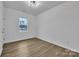 Clean bedroom featuring new light fixture and luxury vinyl plank flooring at 2853 W Zion Church Rd, Shelby, NC 28150