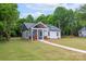Charming cottage-style home featuring a welcoming front porch and well-manicured lawn at 2853 W Zion Church Rd, Shelby, NC 28150