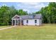 Charming cottage-style home featuring a welcoming front porch and well-manicured lawn at 2853 W Zion Church Rd, Shelby, NC 28150