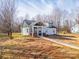 A charming single-Gathering home showcases a covered front porch and pristine lawn, nestled in a serene wooded area at 2853 W Zion Church Rd, Shelby, NC 28150