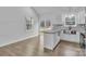 Kitchen island with granite countertop, stainless steel sink, and luxury vinyl plank flooring at 2853 W Zion Church Rd, Shelby, NC 28150