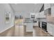 Well-lit kitchen with granite countertops, stainless steel appliances, white cabinets, and sliding glass door at 2853 W Zion Church Rd, Shelby, NC 28150