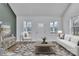 Cozy living room with ample natural light from surrounding windows, with stylish decor and comfortable seating at 2853 W Zion Church Rd, Shelby, NC 28150