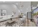 Bright living room featuring vaulted ceilings, modern decor, and an open layout to dining and kitchen spaces at 2853 W Zion Church Rd, Shelby, NC 28150