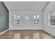 Bright living room with hardwood floors and multiple windows, offering abundant natural light at 2853 W Zion Church Rd, Shelby, NC 28150