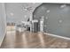 Spacious open-concept living area with hardwood floors and modern stainless steel appliances at 2853 W Zion Church Rd, Shelby, NC 28150