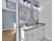 The stylish bathroom offers double sinks, granite counters, and modern fixtures at 2855 W Zion Church Rd, Shelby, NC 28150
