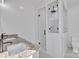 This bathroom provides a double sink vanity with a modern tiled walk-in shower at 2855 W Zion Church Rd, Shelby, NC 28150