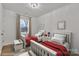 This bedroom features two twin beds, matching decor, and lots of natural light at 2855 W Zion Church Rd, Shelby, NC 28150