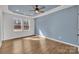 Spacious main bedroom features natural light from windows and a tray ceiling with a ceiling fan at 2855 W Zion Church Rd, Shelby, NC 28150