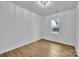 Bright bedroom with light-colored walls, wood-look floors, and a window with natural light at 2855 W Zion Church Rd, Shelby, NC 28150