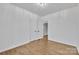 Bright bedroom with light-colored walls, wood-look floors, and modern ceiling light at 2855 W Zion Church Rd, Shelby, NC 28150