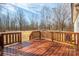 Spacious, varnished wood deck overlooks the backyard and surrounding foliage at 2855 W Zion Church Rd, Shelby, NC 28150