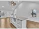 A kitchen island features sleek cabinetry, granite countertops, and space for seating at 2855 W Zion Church Rd, Shelby, NC 28150