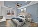 This main bedroom offers a tray ceiling, a ceiling fan, and lots of natural light at 2855 W Zion Church Rd, Shelby, NC 28150