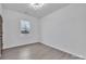 Neutral guest bedroom features bright white walls, wood-look floors, and natural light at 2867 W Zion Church Rd, Shelby, NC 28150